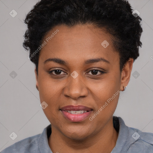 Joyful black young-adult female with short  black hair and brown eyes