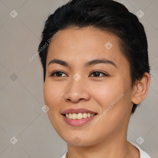 Joyful asian young-adult female with short  brown hair and brown eyes