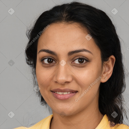 Joyful latino young-adult female with medium  brown hair and brown eyes