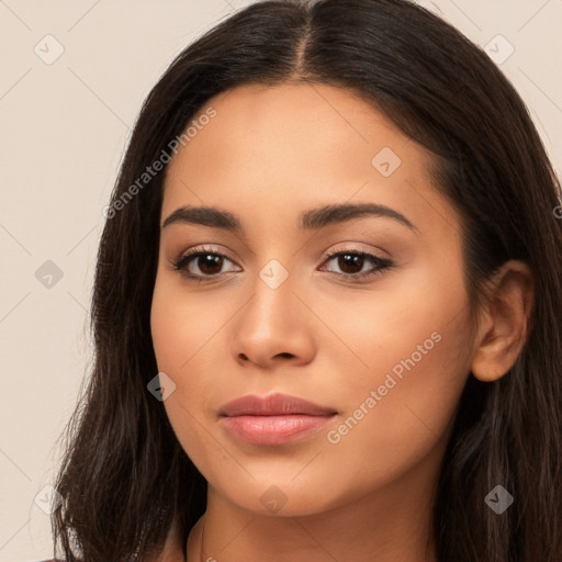 Joyful latino young-adult female with long  brown hair and brown eyes