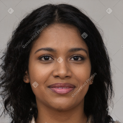 Joyful black young-adult female with long  brown hair and brown eyes