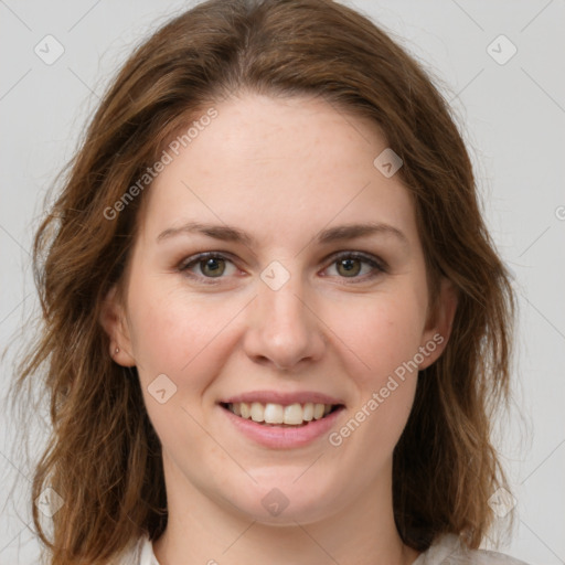 Joyful white young-adult female with medium  brown hair and green eyes