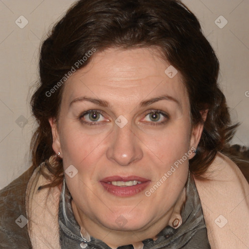 Joyful white adult female with medium  brown hair and blue eyes