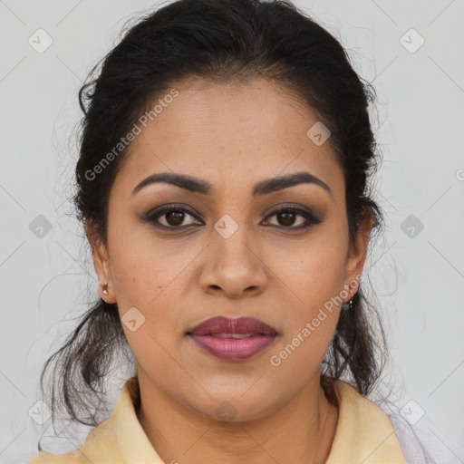 Joyful latino young-adult female with medium  brown hair and brown eyes