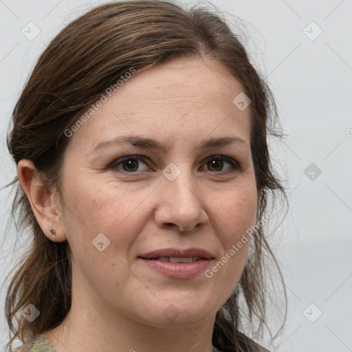 Joyful white adult female with medium  brown hair and grey eyes