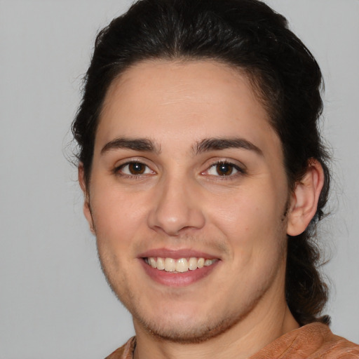 Joyful white young-adult male with medium  brown hair and brown eyes