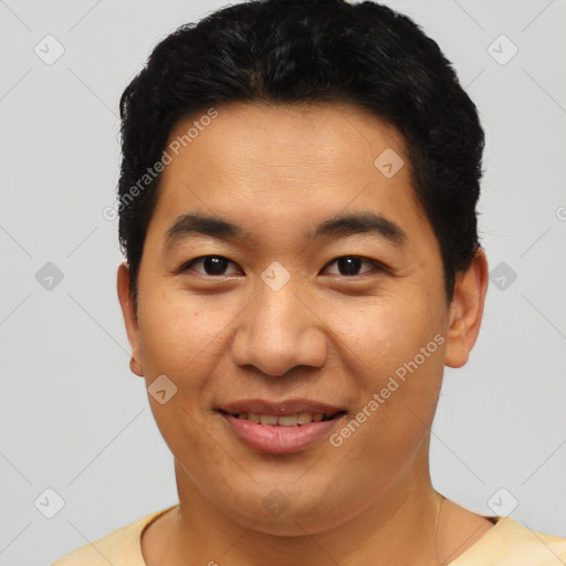 Joyful asian young-adult male with short  black hair and brown eyes