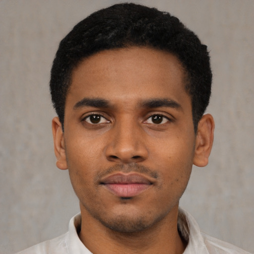 Neutral latino young-adult male with short  black hair and brown eyes