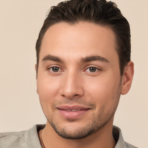 Joyful white young-adult male with short  brown hair and brown eyes