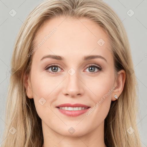 Joyful white young-adult female with long  brown hair and blue eyes