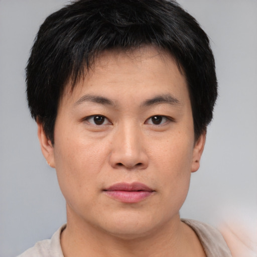 Neutral asian young-adult male with short  brown hair and brown eyes