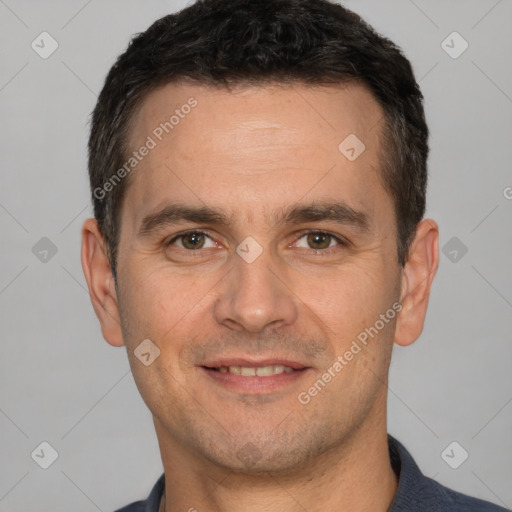 Joyful white adult male with short  brown hair and brown eyes