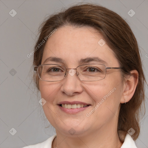 Joyful white adult female with medium  brown hair and brown eyes