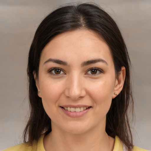 Joyful white young-adult female with medium  brown hair and brown eyes