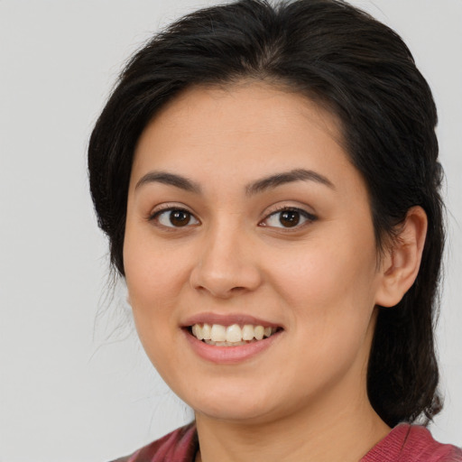 Joyful asian young-adult female with medium  brown hair and brown eyes