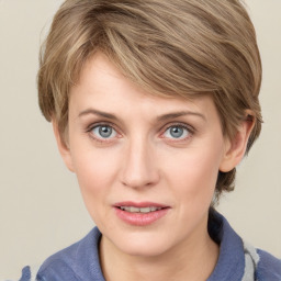 Joyful white young-adult female with medium  brown hair and blue eyes