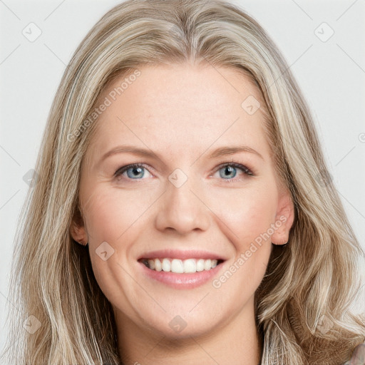 Joyful white young-adult female with long  brown hair and blue eyes