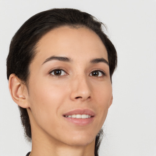 Joyful white young-adult female with medium  brown hair and brown eyes