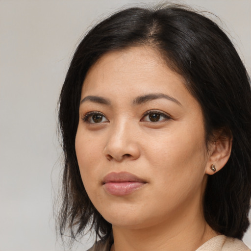Neutral asian young-adult female with medium  brown hair and brown eyes