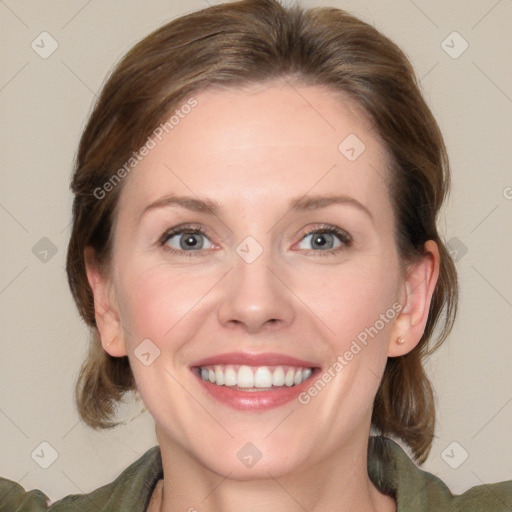 Joyful white young-adult female with medium  brown hair and blue eyes