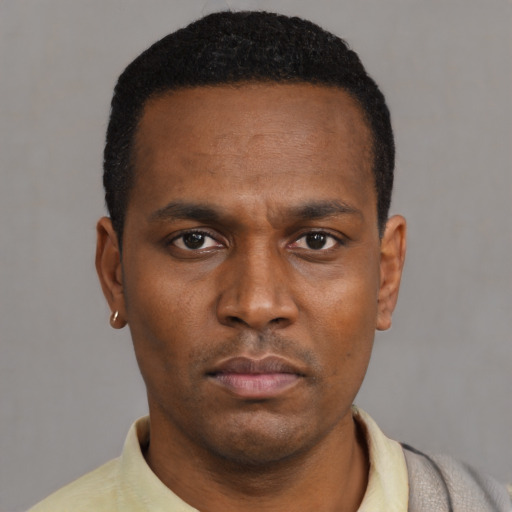 Neutral black young-adult male with short  black hair and brown eyes