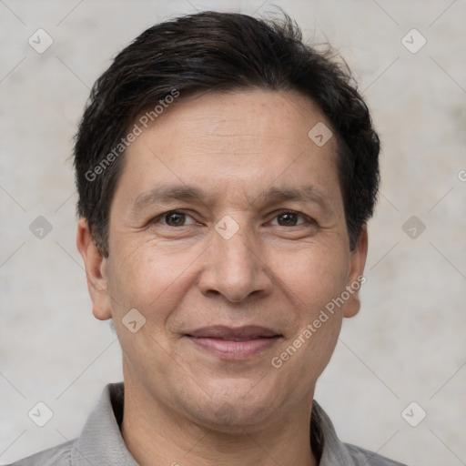 Joyful white adult male with short  brown hair and brown eyes