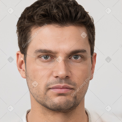 Neutral white young-adult male with short  brown hair and brown eyes