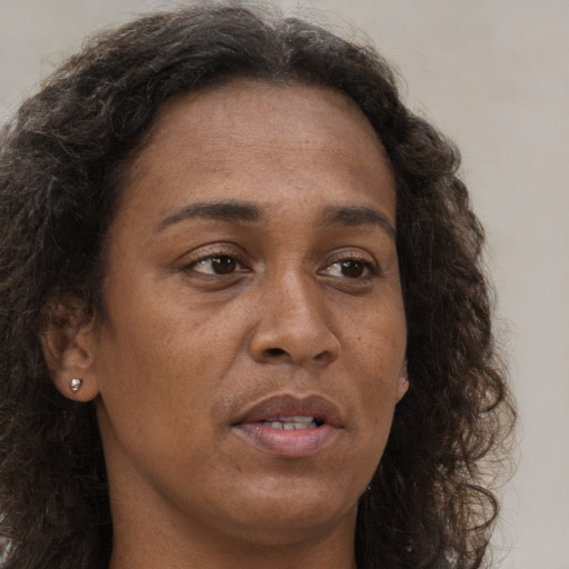Neutral white adult female with long  brown hair and brown eyes