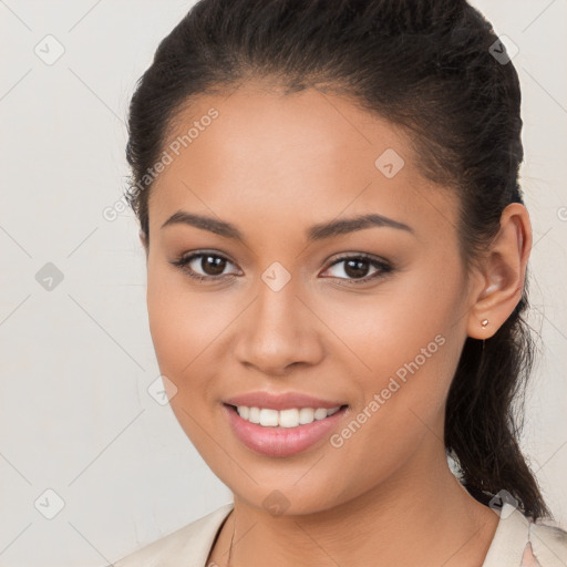 Joyful white young-adult female with long  brown hair and brown eyes