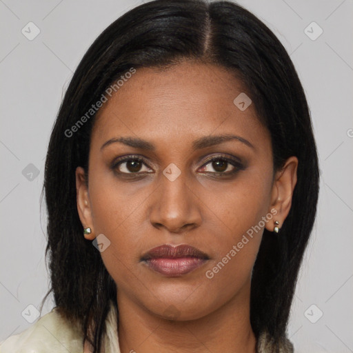 Joyful latino young-adult female with long  brown hair and brown eyes