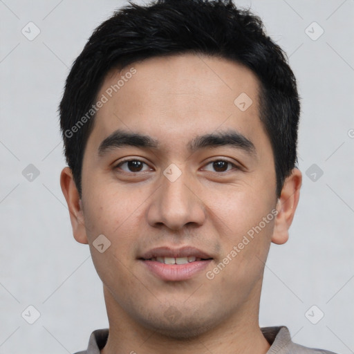 Joyful latino young-adult male with short  black hair and brown eyes