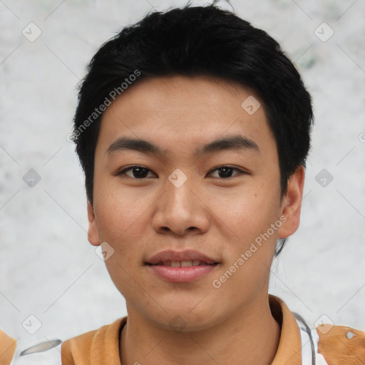 Joyful asian young-adult male with short  black hair and brown eyes