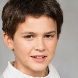 Joyful white child male with short  brown hair and brown eyes