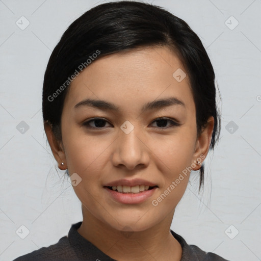 Joyful asian young-adult female with medium  black hair and brown eyes