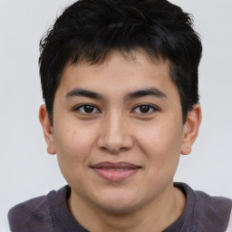 Joyful asian young-adult male with short  brown hair and brown eyes