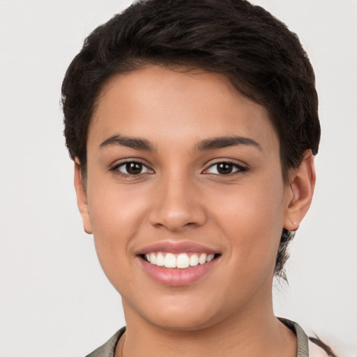 Joyful white young-adult female with short  brown hair and brown eyes