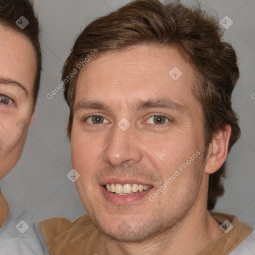 Joyful white adult male with short  brown hair and brown eyes