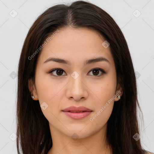 Joyful asian young-adult female with long  brown hair and brown eyes