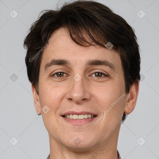 Joyful white adult male with short  brown hair and brown eyes