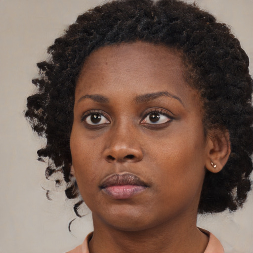 Neutral black young-adult female with medium  black hair and brown eyes
