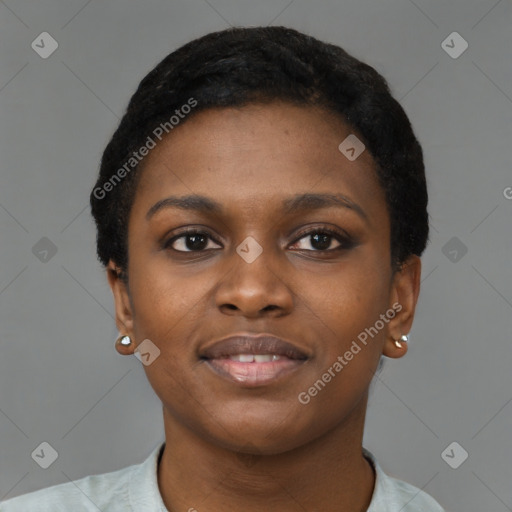 Joyful black young-adult female with short  black hair and brown eyes