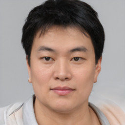 Neutral asian young-adult male with short  brown hair and brown eyes