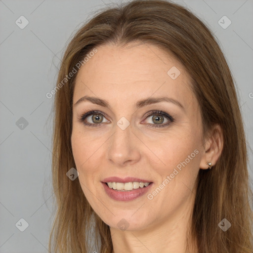 Joyful white adult female with long  brown hair and brown eyes