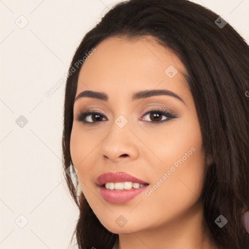 Joyful white young-adult female with long  black hair and brown eyes