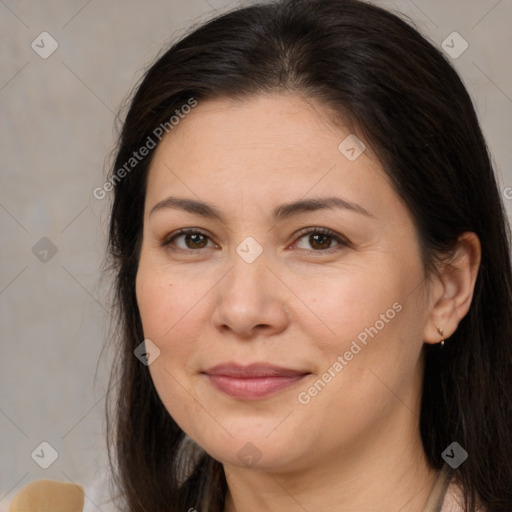 Joyful white adult female with long  brown hair and brown eyes