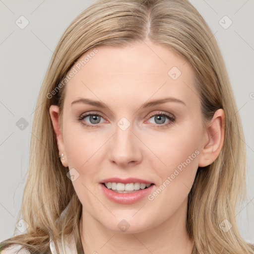 Joyful white young-adult female with long  brown hair and blue eyes