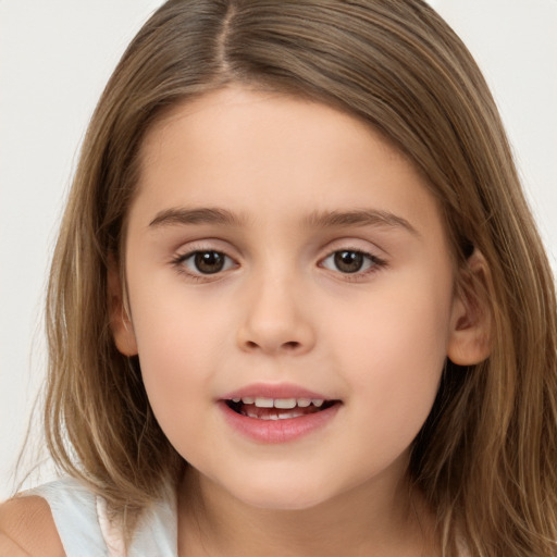 Joyful white child female with long  brown hair and brown eyes