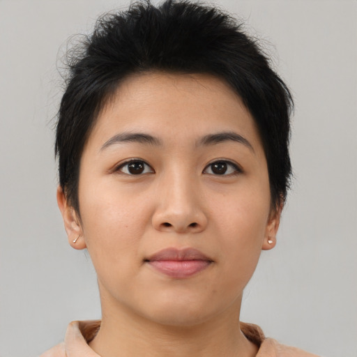 Joyful asian young-adult female with short  brown hair and brown eyes