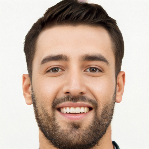 Joyful white young-adult male with short  black hair and brown eyes