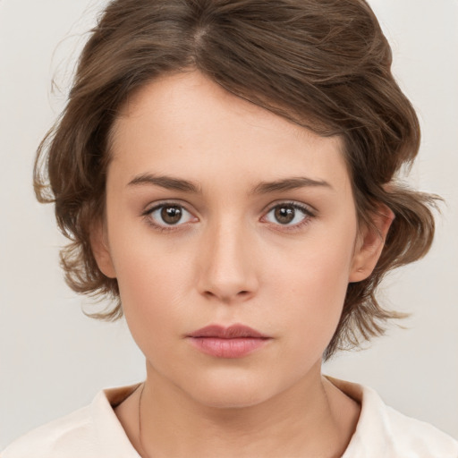 Neutral white young-adult female with medium  brown hair and brown eyes